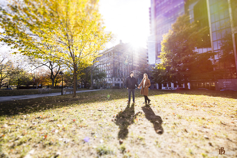 engaged couple basking in the fall sun